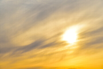Evening sunset sky with blue and yellow clouds