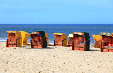 Roofed wicker beach chairs. Egmond aan Zee, North Sea, the Netherlands.