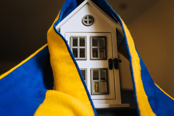 Ukrainian house, embassy in the country with the national yellow-blue flag. Shelter for homeless...