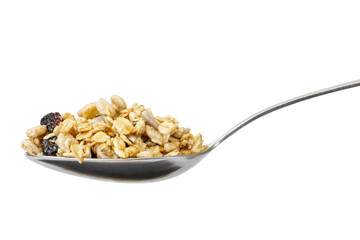 Muesli on a steel spoon isolated on white background. Front view.