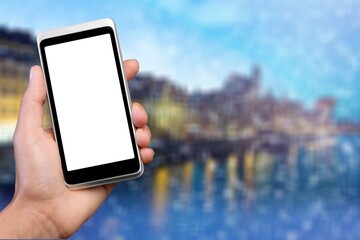 Hands holding smartphone with blank screen