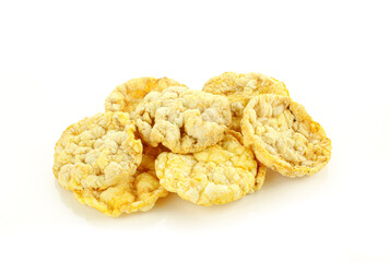 Stack of thin corn rice cracker chips isolated on white background. Healthy dietetic food