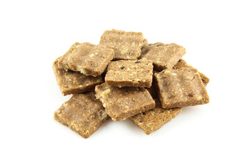 Bunch of bite size oatmeal cookies isolated on white background. Light dietary food