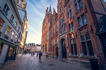 Naklejka premium Streets of Bruges Belgium - the City centre - Wallpaper - stores and shops