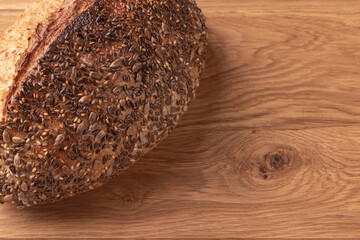 fresh homemade bread on wooden background, top view