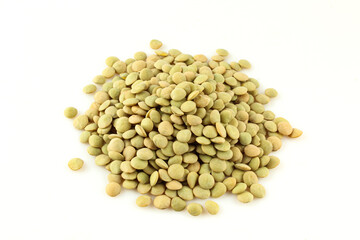 Pile of fresh uncooked lentils isolated on white background.