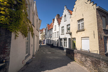Fototapeta na wymiar Streets of Bruges Belgium - the City centre - Wallpaper - stores and shops