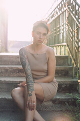 Young tattooed woman summer portrait - 509242273