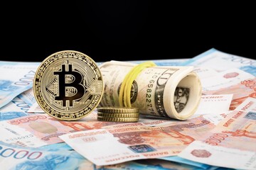 Bitcoin Cryptocurrency and Russian Rubles banknotes. BTC Bitcoin Cryptocurrency Russia Ruble Money