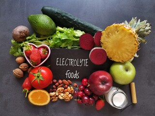 Healthy food high in electrolytes. Fresh fruit and vegetable as natural  sources of electrolytes. Foods to naturally replenish electrolytes. Celery, pineapple, milk, yogurt, apple, nuts, avocado...
