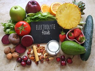 Healthy food high in electrolytes. Fresh fruit and vegetable as natural  sources of electrolytes. Foods to naturally replenish electrolytes. Celery, pineapple, milk, yogurt, apple, nuts, avocado...