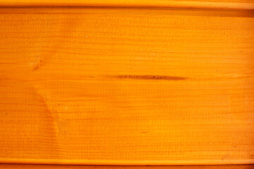 The background surface is a light wood texture with a natural pattern. Natural background