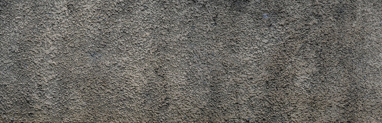 Panoramic abstract cracked plastered stone wall. Antique plaster background.