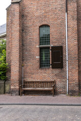 Fototapeta na wymiar Intimate Chapel from 1390 with its beautiful arched windows and men's hall (Mannenzaal) behind it - remained from medieval building of St. Pieters en Bloklands Gasthuis. Amersfoort, the Netherlands.
