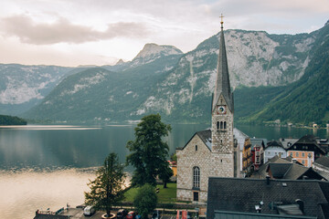 photograph of the main church of hallstatt austria with a view towards the lake