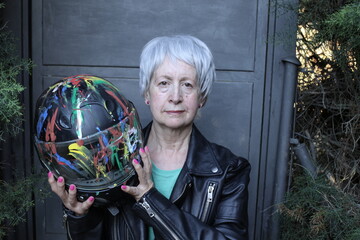 Senior female motorcyclist with cool look