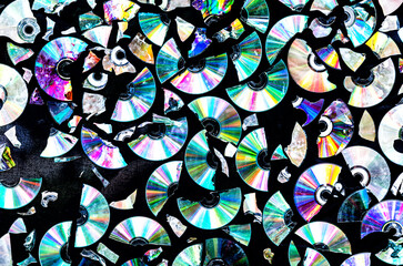 Background made of broken CD and DVD data discs