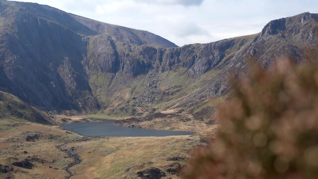 Llyn Idwal mountain lake static view of Snowdonia in North Wales with shallow focus foliage