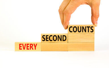 Every second counts symbol. Concept words Every second counts on wooden blocks on a beautiful white table white background. Businessman hand. Business, motivational and every second counts concept.