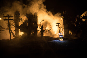 Silhouette soldier carrying little boy on his shoulder from fire. Rescue savior concept. Man moving...