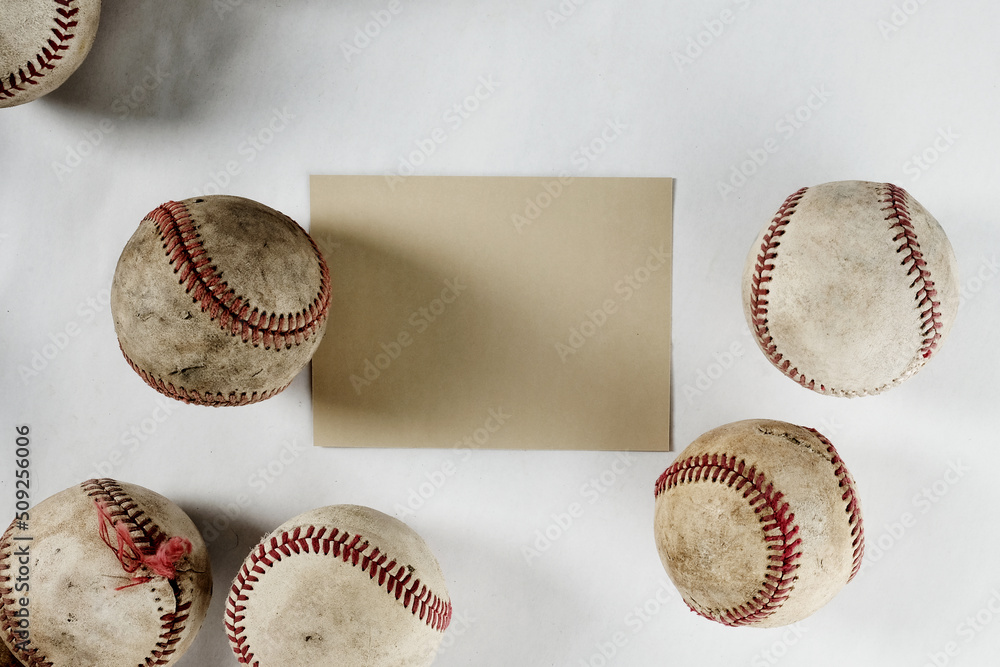 Wall mural vintage used baseballs on white background with copy space on note card for sports game concept. - Wall murals