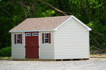 a nice new gray storage shed
