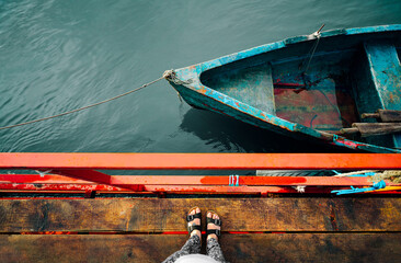Woman on pier by boat