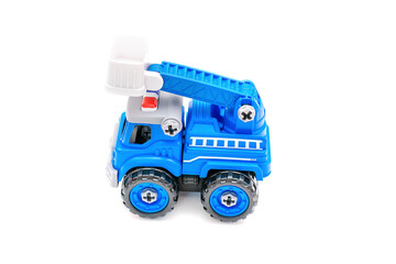 Colorful little mini blue plastic police car tower,crane machine toy isolated on white background, mockup with copy space, toys for children,for boys, kids development, playing, childhood fun