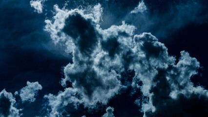Dramatic Dark Blue Ominous Fluffy Clouds or Smoke Plumes