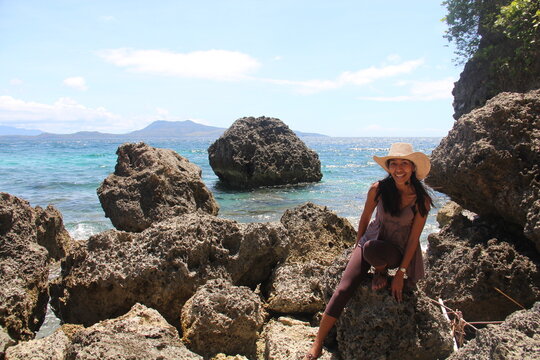 woman surrounded with lava rocks