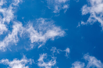 Sky is blue in clouds in sunlight on summer day of natural beauty. Abstract background sky in clouds on blue background.