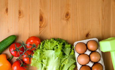 Flat lay of healthy product near heart and dumbbells. Diet and detox. Healthy eating habits. Sporty lifestyle.