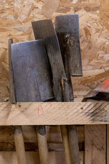 Close-up of spades, garden tools, stored in a wooden shed