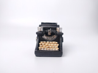 Black vintage typewritter on a white background.