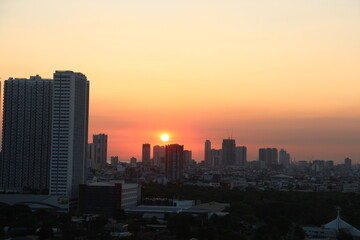 Fototapeta na wymiar Sunset in Metro Manila skyscrapers, Manila, Philippines