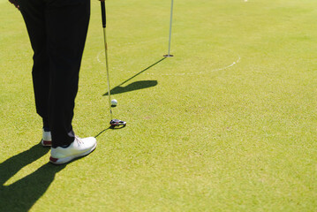 Fototapeta na wymiar Asian man golfing on the course. In summer