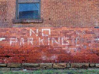 No parking sign on an abandoned building in Hinton WV USA