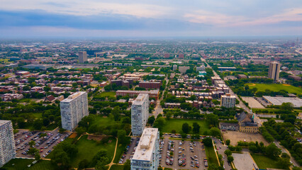 Chicago, IL USA June 5th 2022: Aerial drone view of a Chicago neighborhood downtown. the city beautiful architectural is also covered by lush green trees throughout the urban cityscape