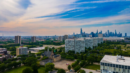 Fototapeta na wymiar Chicago, IL USA June 5th 2022: Aerial drone view of a Chicago neighborhood downtown. the city beautiful architectural is also covered by lush green trees throughout the urban cityscape