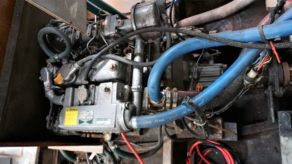 Engine, Sailboat steel engine operating on fuel for vehicle propulsion. Burning fossil fuels that provide energy and locomotion and displacement.