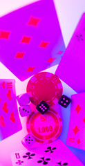 poker chips and dice on a colored background