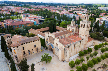 View from drone of ancient Benedictine abbey in Sant Cugat del Valles, Catalonia, Spain.