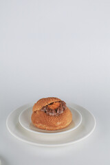Delicious homemade choux pastry with custard and Marian Plum or Mayongchid. on white background