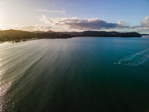 Two Jet Skis Flying Along The New Zealand Coast