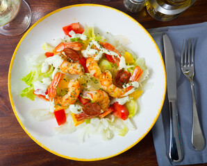 Seafood salad with shrimps, lettuce leaf, tomatoes and lemon. High quality photo