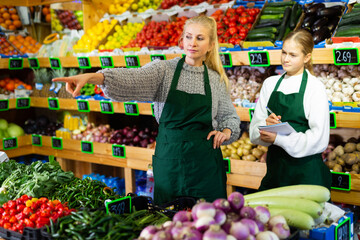 Young girl internship at first job at grocery supermarket