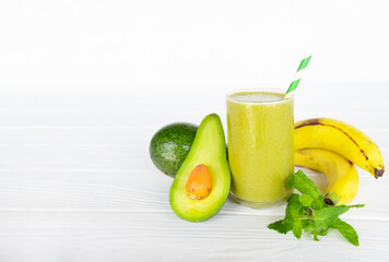 Banana mix avocado fresh cocktail vanilla smoothies  fruit juice beverage healthy the taste yummy in glass drink episode good morning on wooden background from the top view.