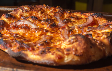 Homemade Italian pizza with natural fermentation, various flavors among them pastrami, bacon and pulled pork,pizza concept