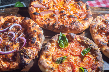 Homemade Italian pizza with natural fermentation, various flavors among them pastrami, bacon and pulled pork,pizza concept