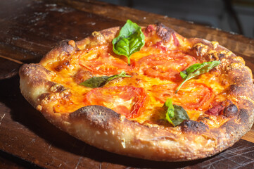 Homemade Italian pizza with natural fermentation, various flavors among them pastrami, bacon and pulled pork,pizza concept